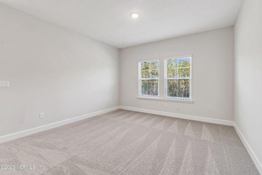 Spacious, unfurnished interior of a new home in Tributary 70', Yulee (Image 21).