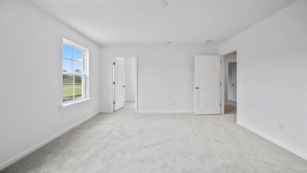 Spacious, unfurnished interior of a new home in Creekside at Andrews, Summerville (Image 11).