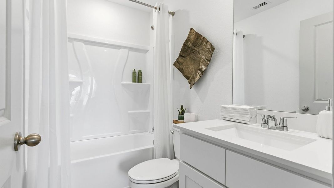 Representative furnished interior of a home built from the Estero by D.R. Horton in Watermark, Alvin (Image 15).