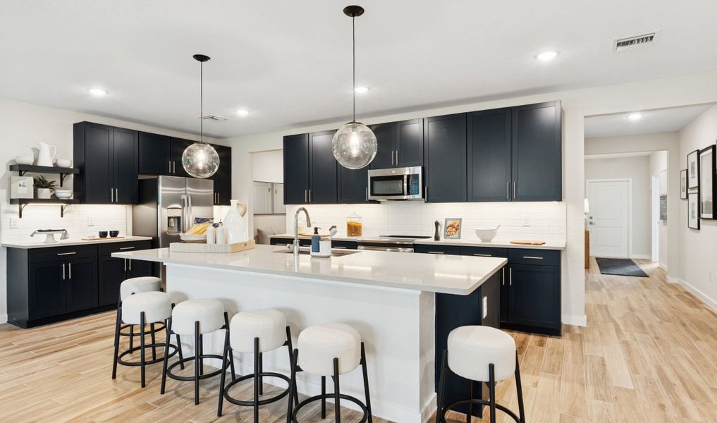 Kitchen with pendant lighting and floating shelves