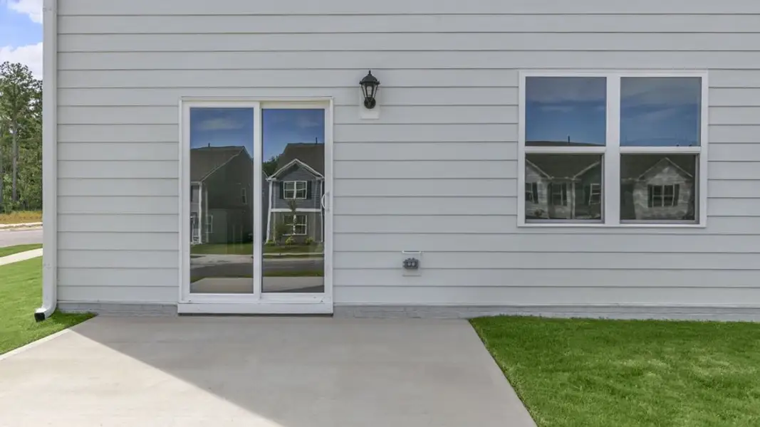 Exterior details and patio area of a home in Tyler - Home on the Lake, New Bern (Image 3).