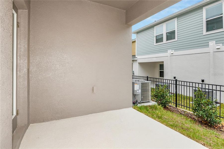 Exterior details and patio area of a home in Grove at Crosswind, Haines City (Image 3).