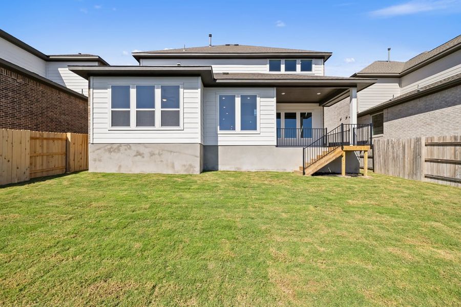 Exterior details and patio area of a home in Park Collection at Lariat, Liberty Hill (Image 31).