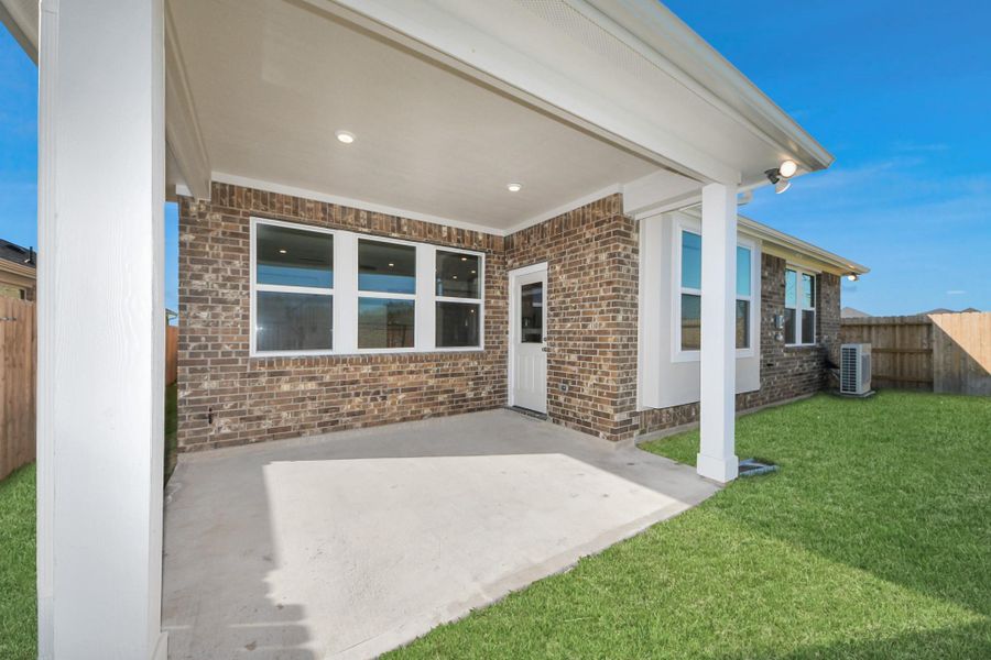 Exterior details and patio area of a home in Sunterra: Landmark Collection, Katy (Image 13).