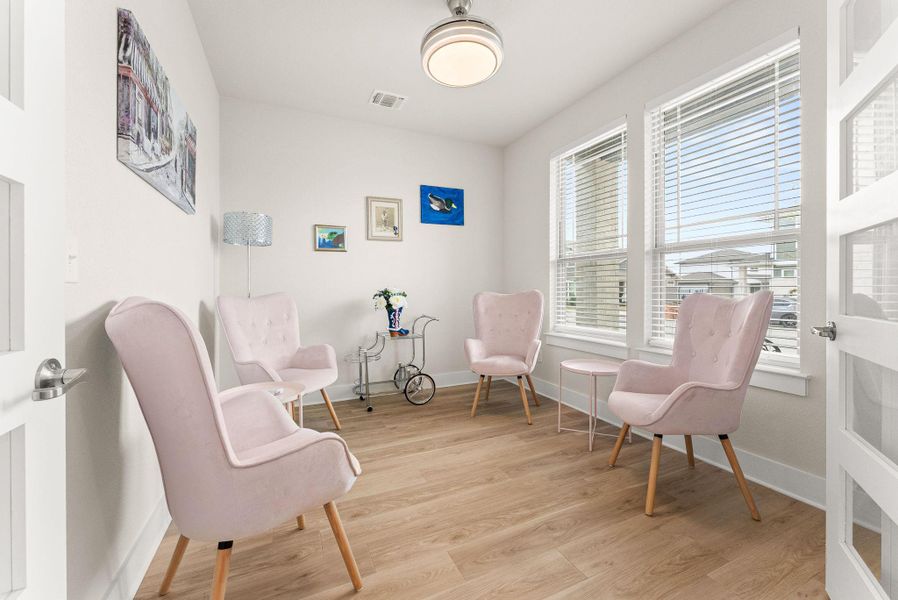 The office has double doors with glass insets.