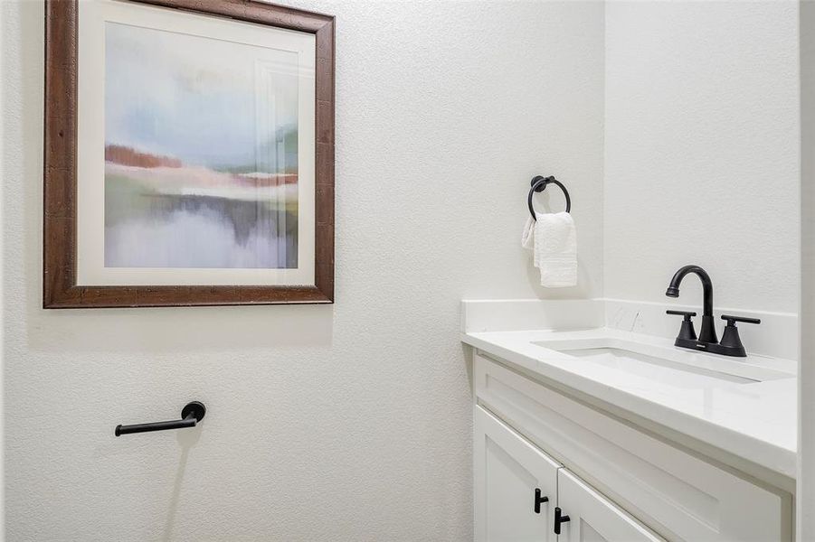 1/2 Bathroom featuring vanity