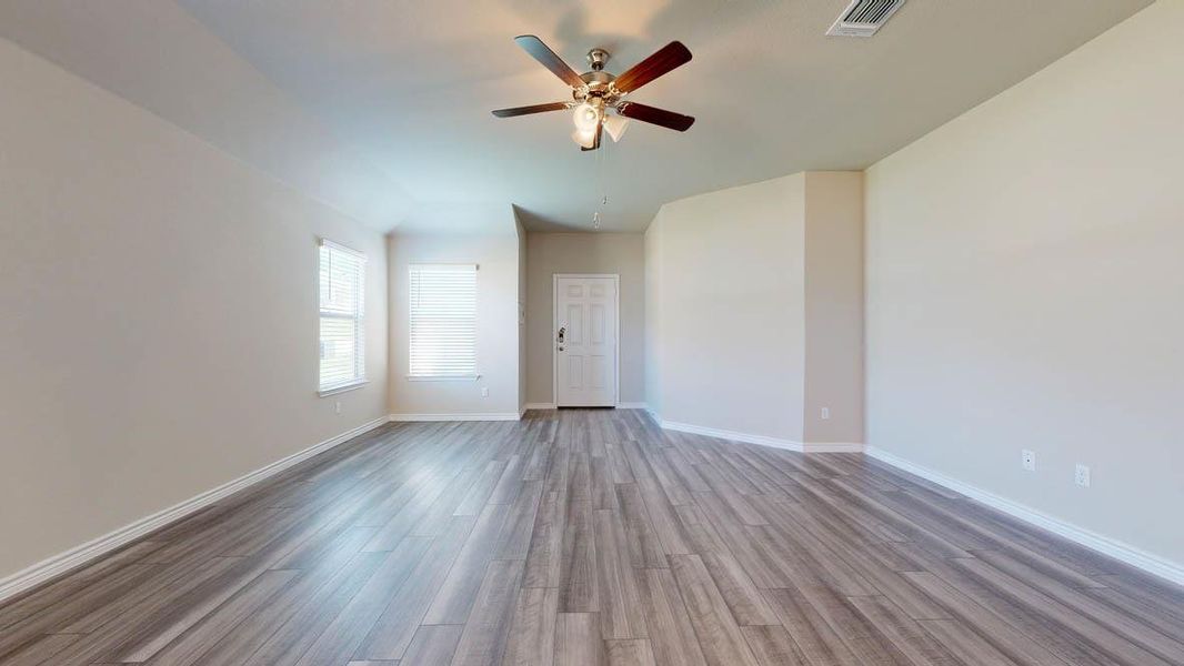 Spacious interior featuring wood-finish flooring and a neutral color palette