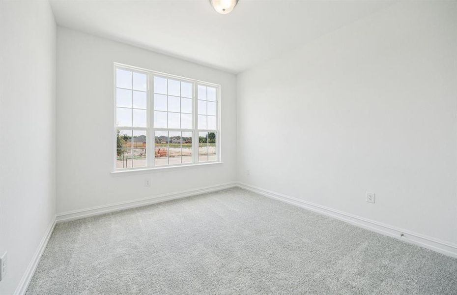 Spacious secondary bedroom features ample closet space *Real home pictured Spacious secondary bedroom features ample closet space *Real home pictured