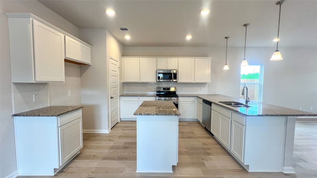 The Sparrow II- Kitchen. Sample floor plan image for illustration; upgrades, options, and colors may vary.
