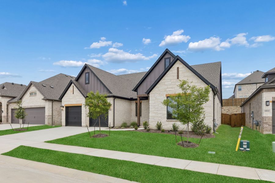 Front exterior of a new home in Timberbrook, Justin, TX, highlighting curb appeal (Image 2). Front exterior of a new home in Timberbrook, Justin, TX, highlighting curb appeal (Image 2).
