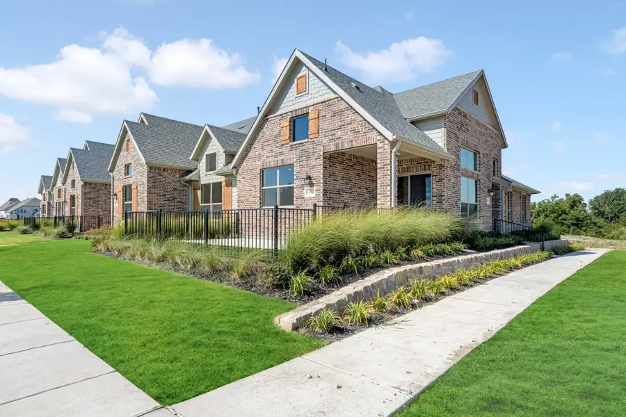 Front exterior of a new home in Cottonwood Creek, Rowlett, TX, highlighting curb appeal (Image 25).