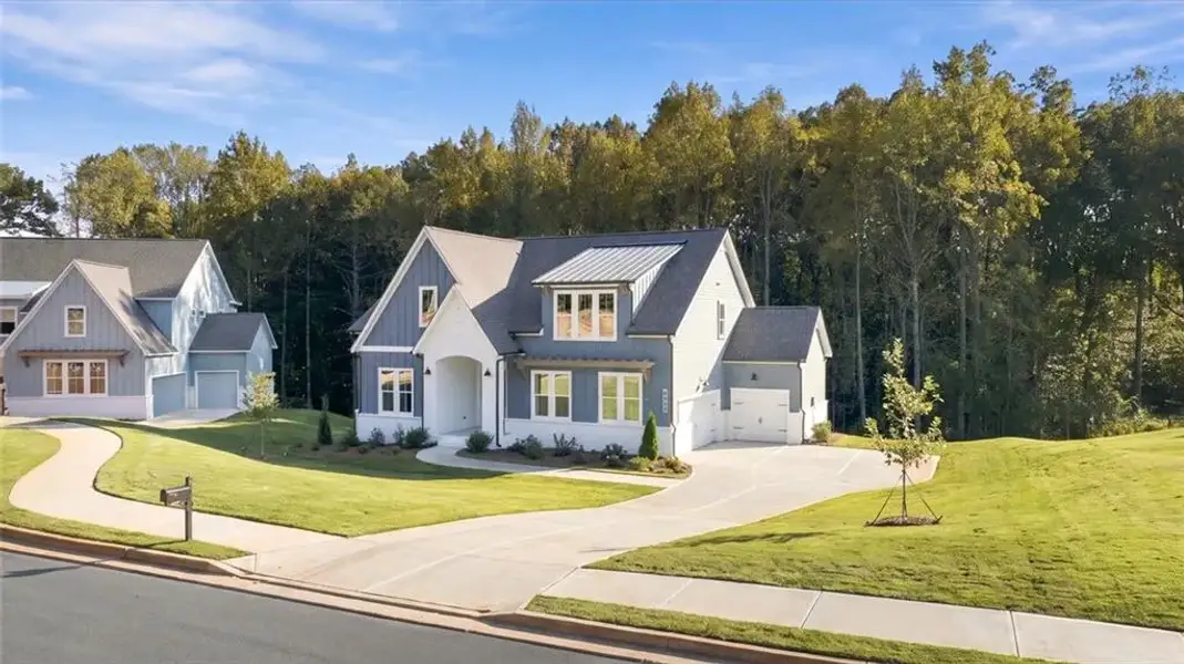 Front exterior of a new home in , Gainesville, GA, highlighting curb appeal (Image 1). Front exterior of a new home in , Gainesville, GA, highlighting curb appeal (Image 1).
