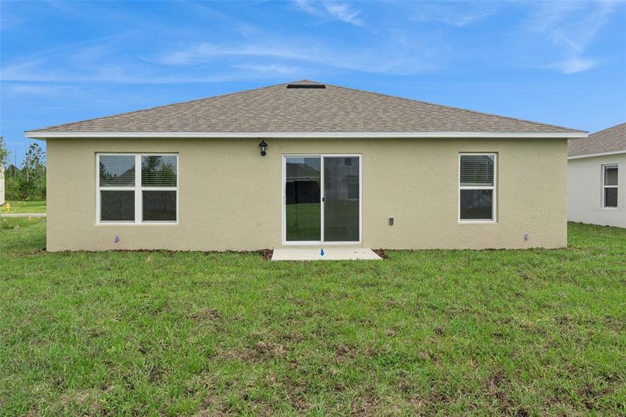 Exterior details and patio area of a home in Poinciana Enclave, Poinciana (Image 2).