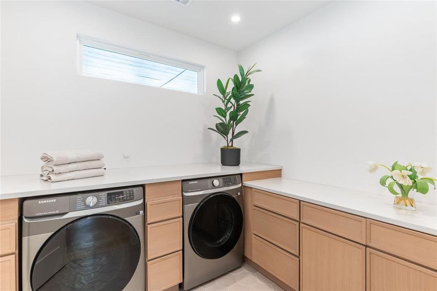 Upstairs, full laundry area with natural light.