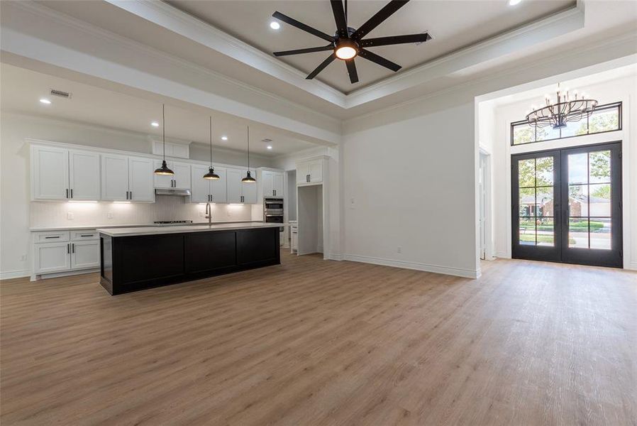 The crown molding in the family room is accented with rope lighting, setting a lovely vibe in the evenings.