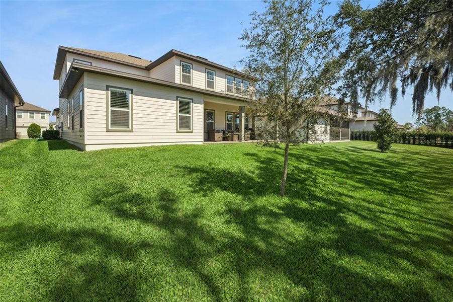 Exterior details and patio area of a home in Northlake at Ovation, Winter Garden (Image 22).