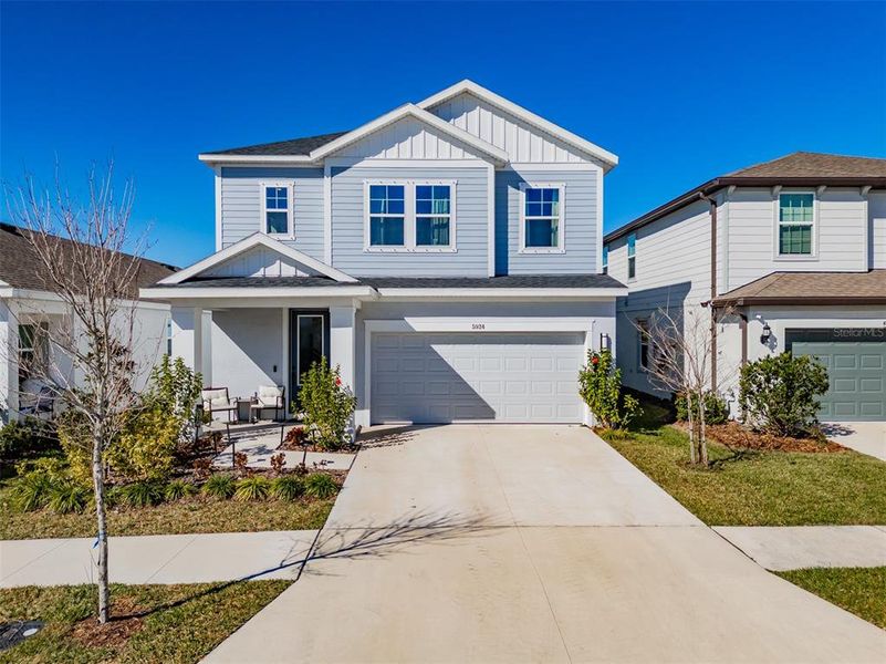 Front exterior of a new home in Waterset Garden Series, Apollo Beach, FL, highlighting curb appeal (Image 2).
