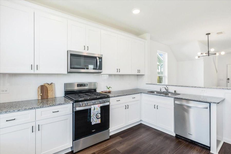 Kitchen features granite countertops , beautiful white cabinets with updates hardware, stainless appliances, large sink and natural light. Kitchen features granite countertops , beautiful white cabinets with updates hardware, stainless appliances, large sink and natural light.