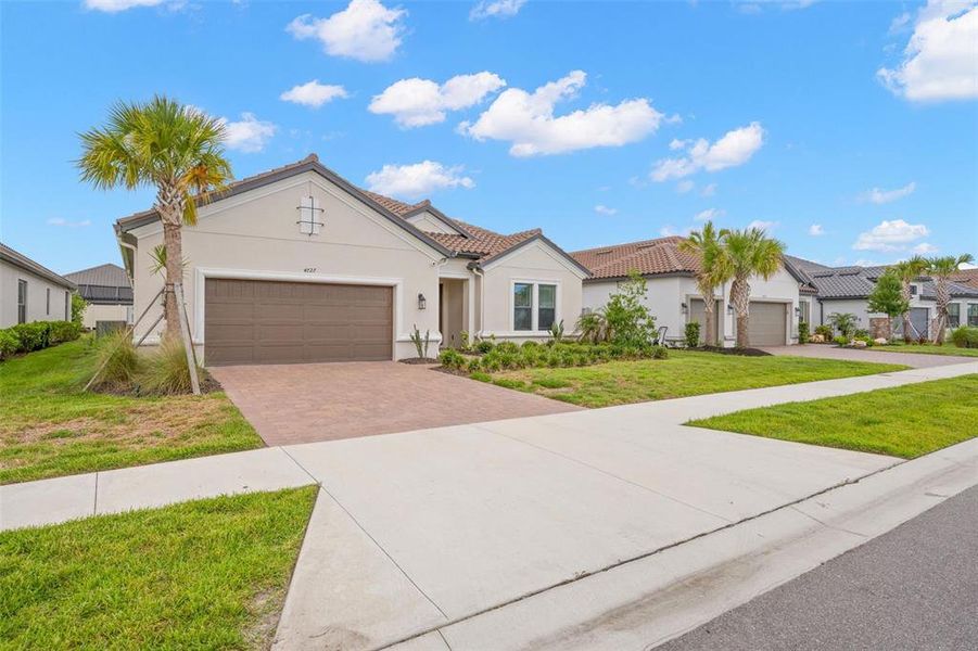 Front exterior of a new home in , Wesley Chapel, FL, highlighting curb appeal (Image 21). Front exterior of a new home in , Wesley Chapel, FL, highlighting curb appeal (Image 21).