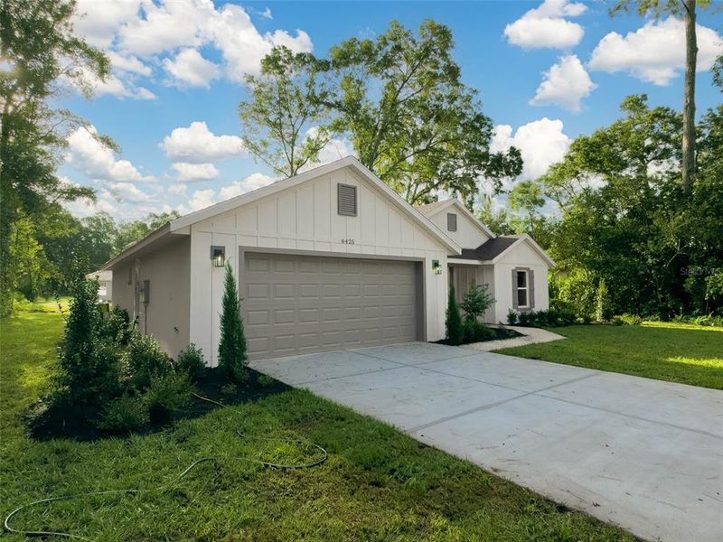 Front exterior of a new home in , Ocala, FL, highlighting curb appeal (Image 16).