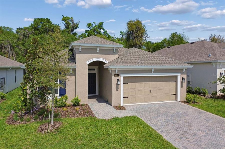 Front exterior of a new home in Cascades at Southern Hills, Brooksville, FL, highlighting curb appeal (Image 29).