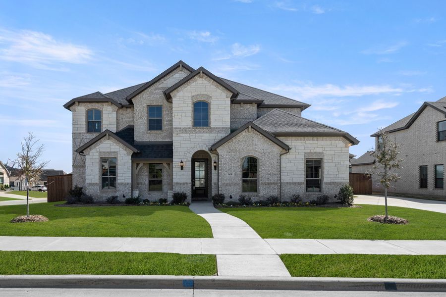 Front exterior of a new home in Hayes Crossing, Midlothian, TX, highlighting curb appeal (Image 1). Front exterior of a new home in Hayes Crossing, Midlothian, TX, highlighting curb appeal (Image 1).