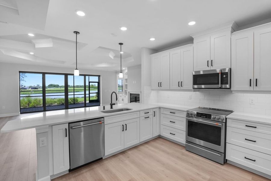 Furnished interior view inside a new home in Esplanade by the Islands Coach Homes, Naples (Image 7).