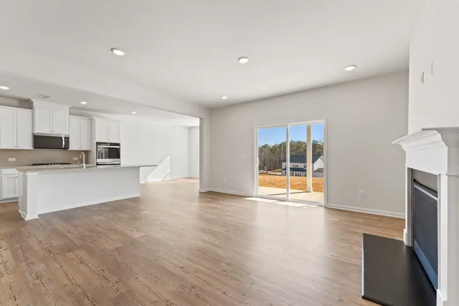 A large kitchen with white cabinets. A large kitchen with white cabinets.