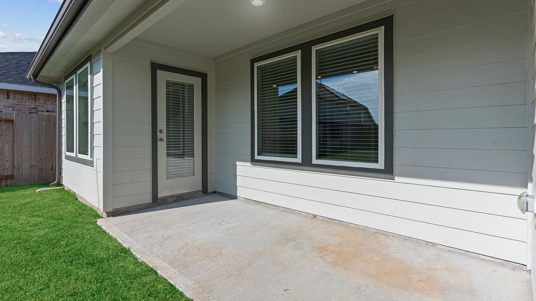 Exterior details and patio area of a home in Caldwell Crossing, Iowa Colony (Image 3). Exterior details and patio area of a home in Caldwell Crossing, Iowa Colony (Image 3).
