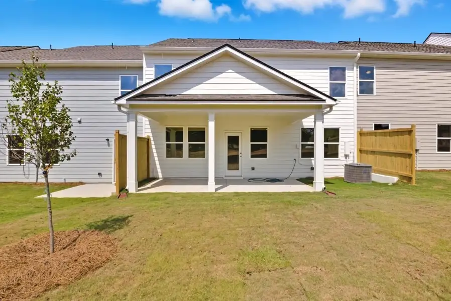 Exterior details and patio area of a home in The Retreat at Browns Ridge, Newnan (Image 2).