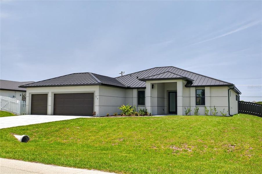 Front exterior of a new home in , Cape Coral, FL, highlighting curb appeal (Image 27).