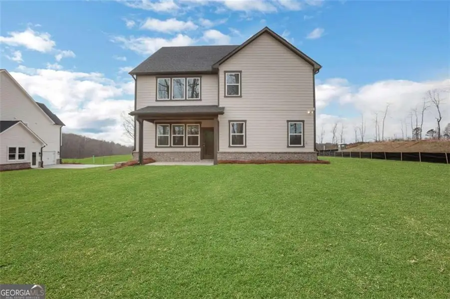Exterior details and patio area of a home in The Paddocks at Doc Hughes, Buford (Image 3).