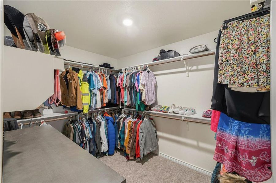 Walk in closet with light colored carpet Walk in closet with light colored carpet