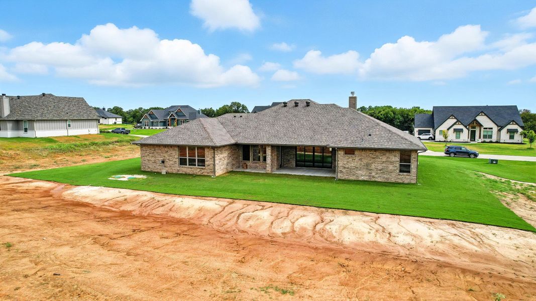 Front exterior of a new home in Rocky Top Ranch, Reno, TX, highlighting curb appeal (Image 21). Front exterior of a new home in Rocky Top Ranch, Reno, TX, highlighting curb appeal (Image 21).