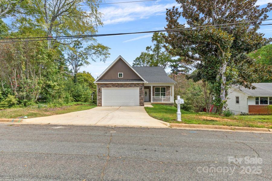 Front exterior of a new home in , Mocksville, NC, highlighting curb appeal (Image 1).