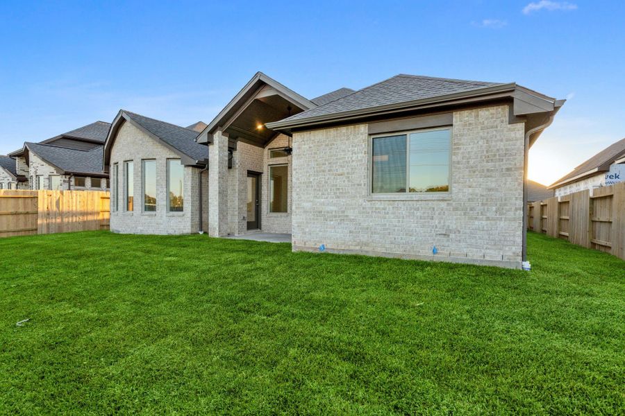 Exterior details and patio area of a home in Coastal Point, League City (Image 22).