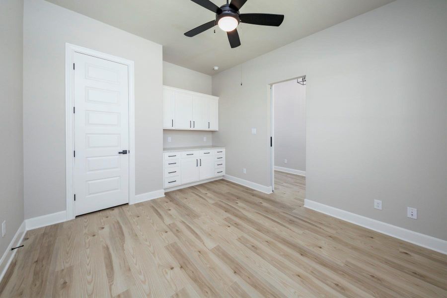 This spacious flex space has a beautiful barn door and built in cabinets. This spacious flex space has a beautiful barn door and built in cabinets.