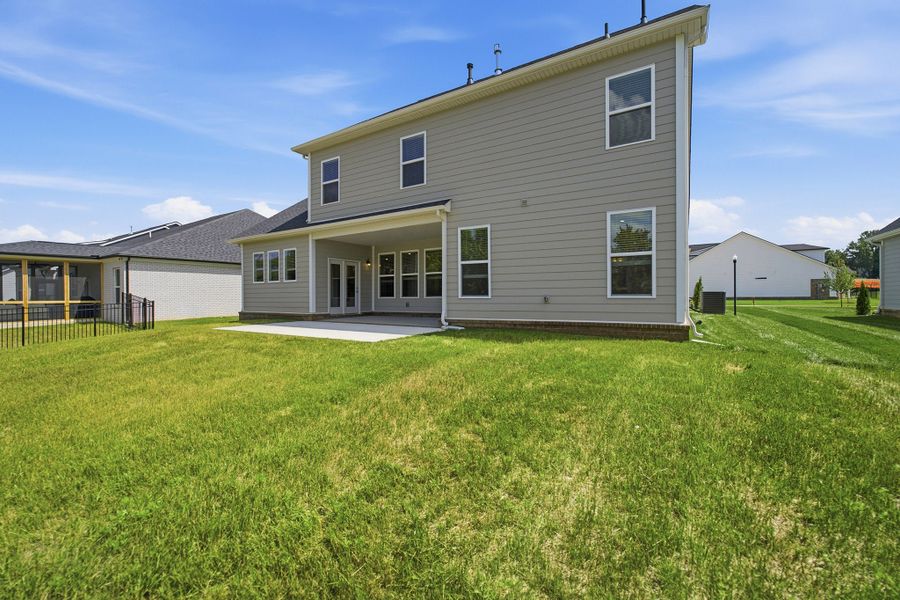 Exterior details and patio area of a home in Dorris Farm, White House (Image 28).