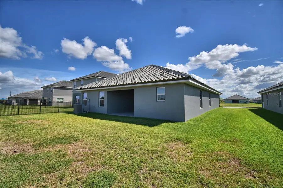 Exterior details and patio area of a home in Lake Juliana Estates, Auburndale (Image 3).
