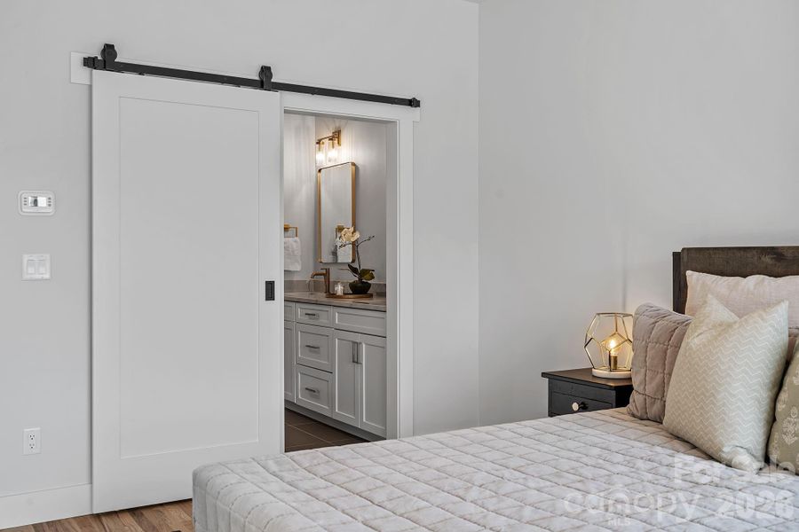 Sliding Barn Door to the Primary En Suite Bath Sliding Barn Door to the Primary En Suite Bath
