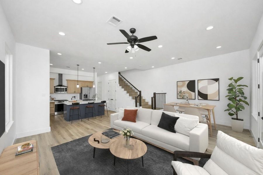 Bright and inviting living space with abundant natural light, an open layout, and seamless access to the backyard—perfect for relaxing or entertaining.