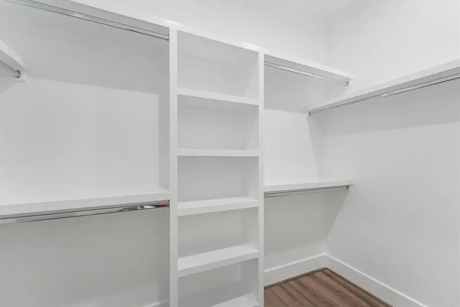 Primary Walk-In Closet Primary Walk-In Closet