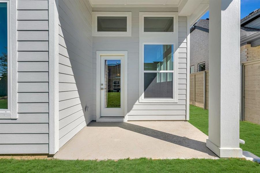 Exterior details and patio area of a home in Treeline, Justin (Image 1).