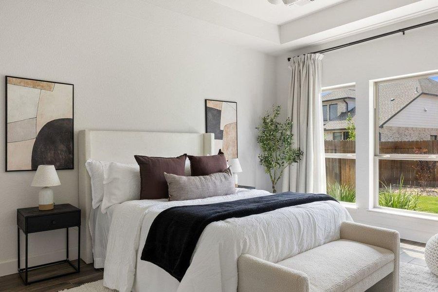 Relax in a generously proportioned bedroom with abundant natural light.