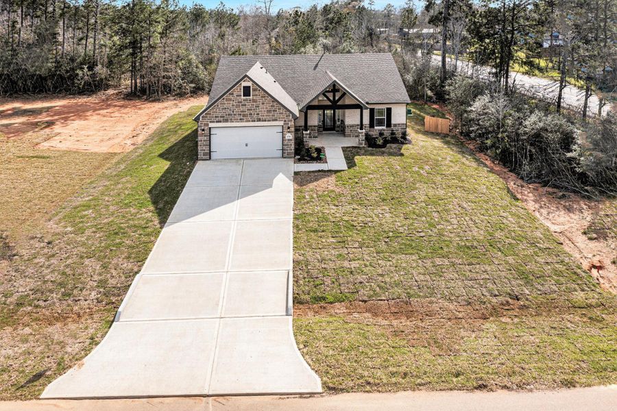Front exterior of a new home in Oakwood Ranch, Willis, TX, highlighting curb appeal (Image 21).
