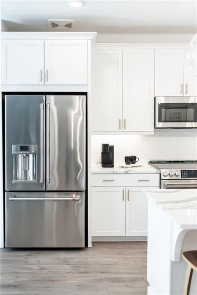 Upgraded appliances in every home with optional Refrigerator. Not actual home. Photos of Model Home.