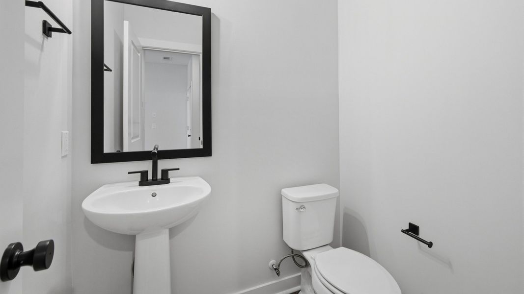 Bathroom with mirror above sink