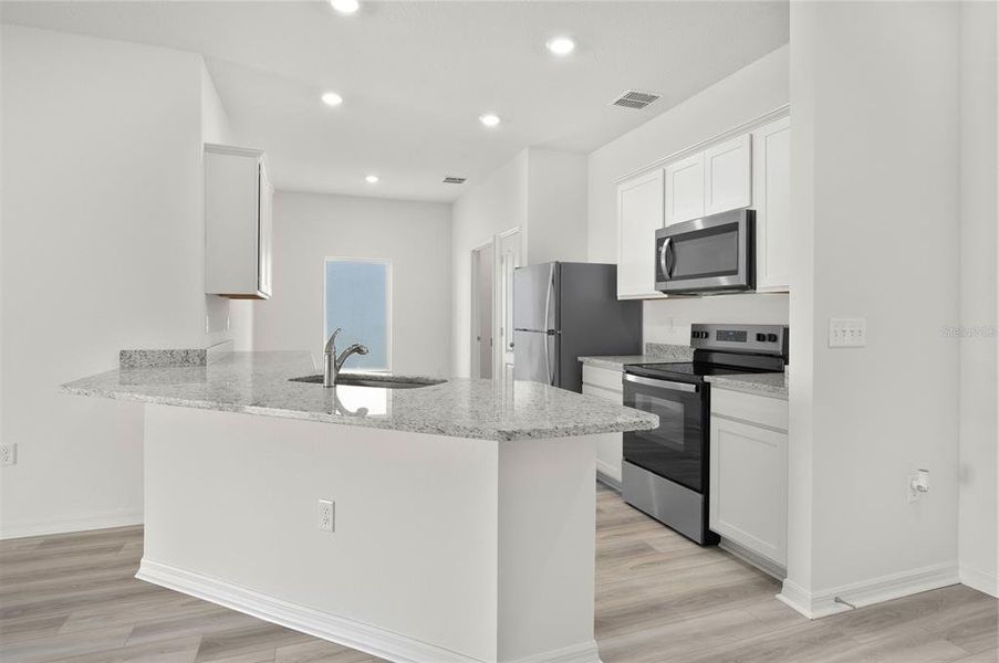 Furnished interior view inside a new home in Tula Parc, Astatula (Image 5).