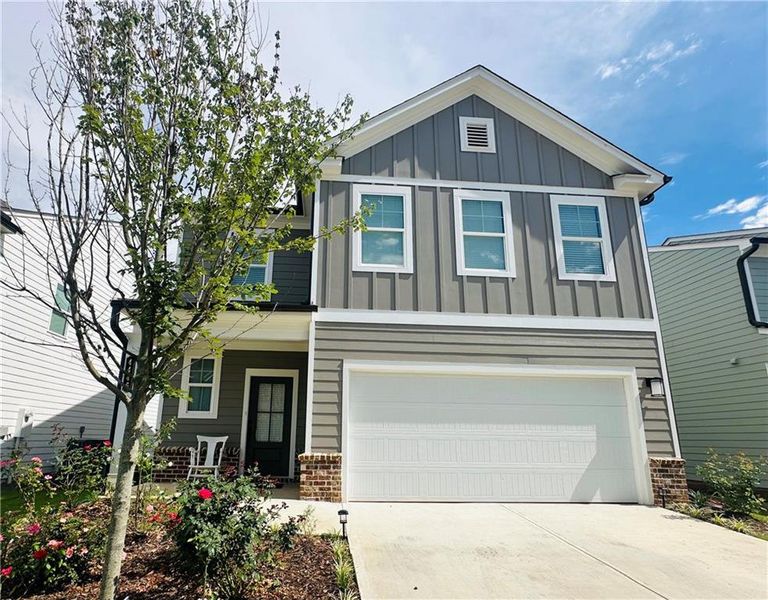 Front exterior of a new home in , Lilburn, GA, highlighting curb appeal (Image 20).