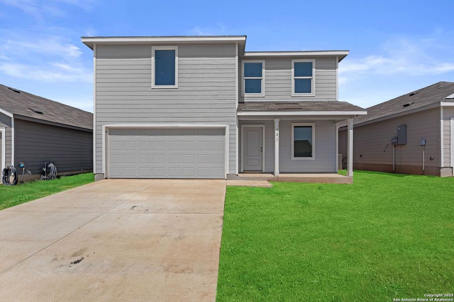 Front exterior of a new home in Lodi Grove, Floresville, TX, highlighting curb appeal (Image 2).